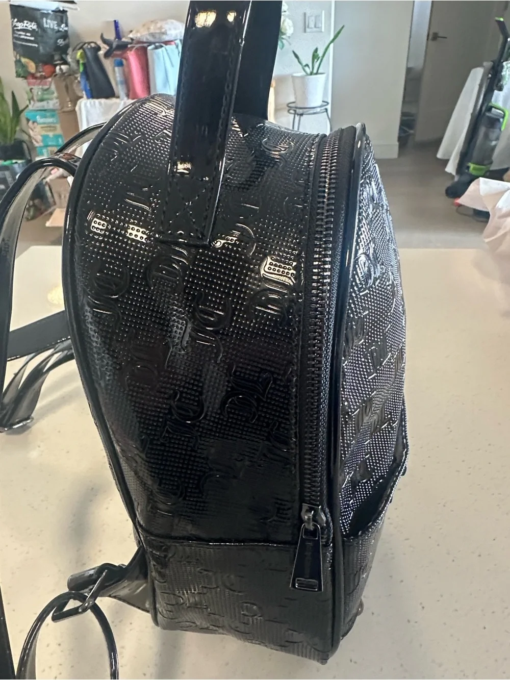 Juicy Couture Black Patent Mini Backpack, new without tags. Excellent condition.